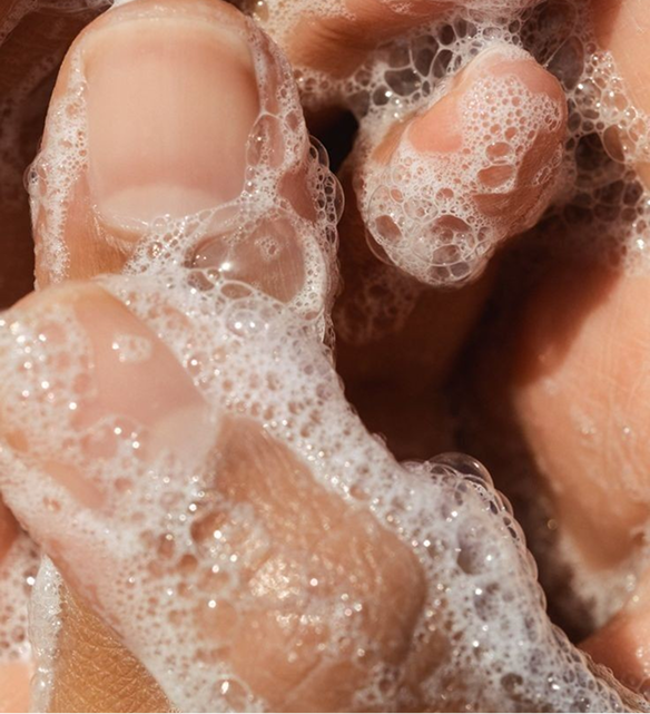 close up of hand covered in soap